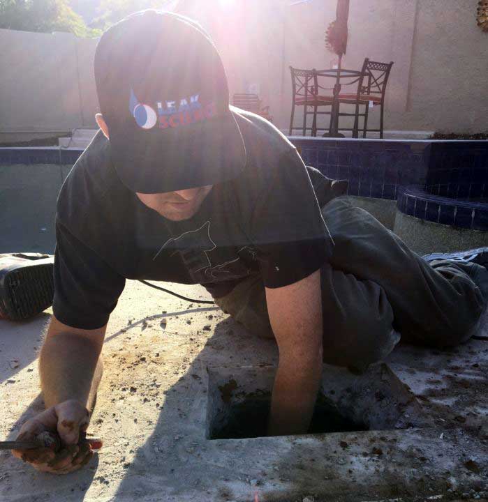 Technician At Work On An Emergency Leak Detection Job